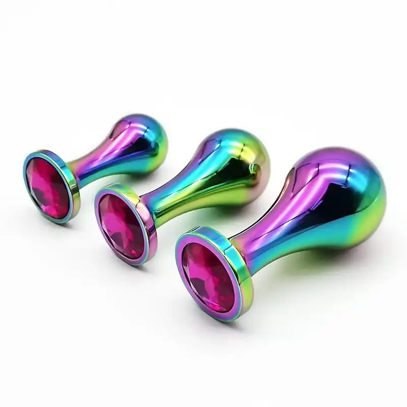 Large metal butt plugs in different sizes in rainbow colors