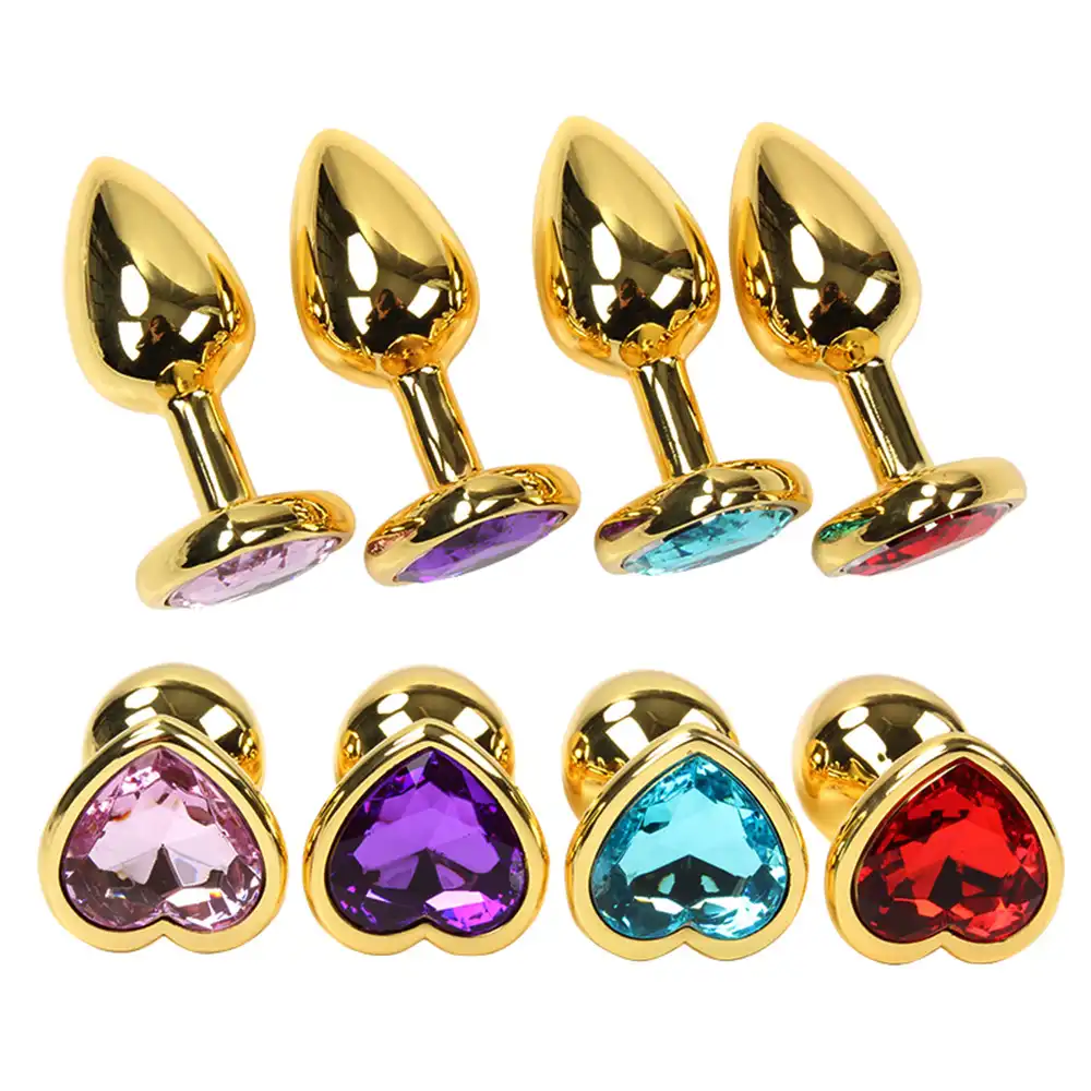 Multiple gold metal heart shaped butt plugs with gemstones